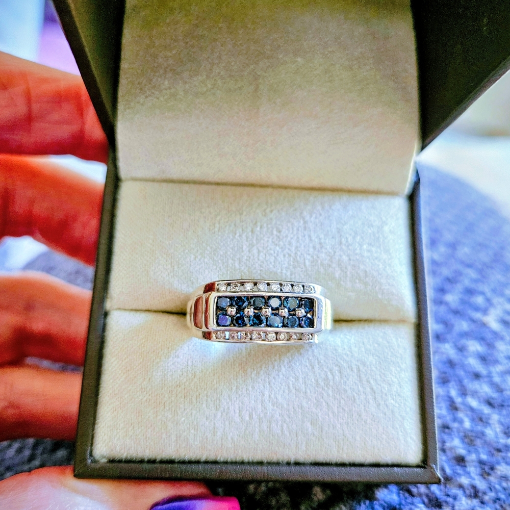 Men's 8.5 London blue topaz and diamond ring set in Sterling silver.
